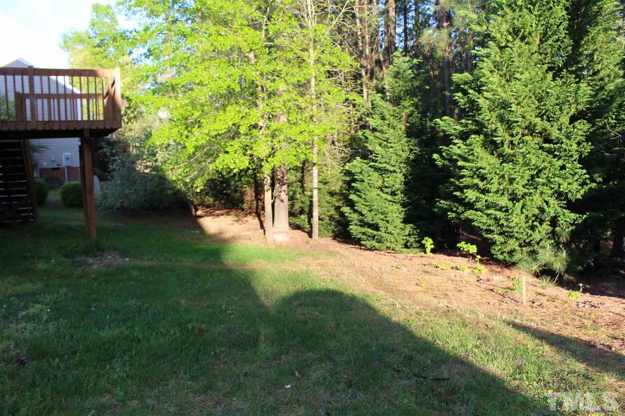 1817 White Dogwood Road Apex, NC 27502 - Photo 13 of 13 a view of a house with a yard and wooden fence