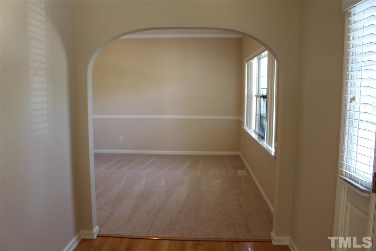 1817 White Dogwood Road Apex, NC 27502 - Photo 3 of 13 an empty room with windows