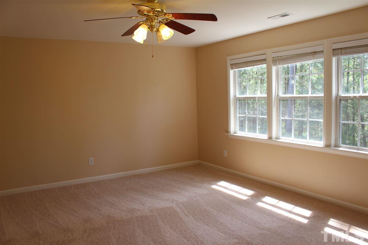 1817 White Dogwood Road Apex, NC 27502 - Photo 8 of 13 a view of an empty room with a window