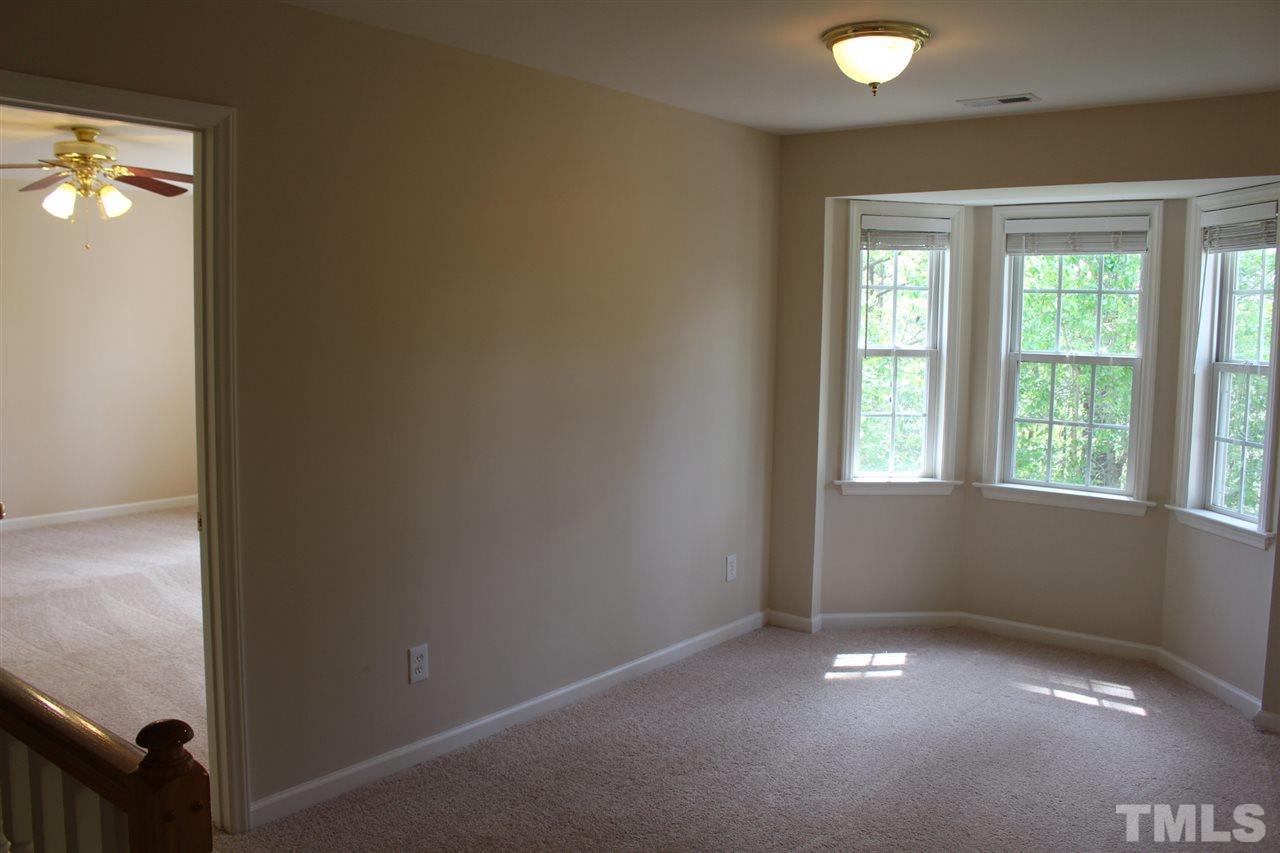 1817 White Dogwood Road Apex, NC 27502 - Photo 10 of 13 an empty room with windows and entrance