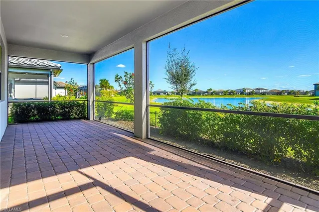 a view of balcony with floor to ceiling windows and wooden floor