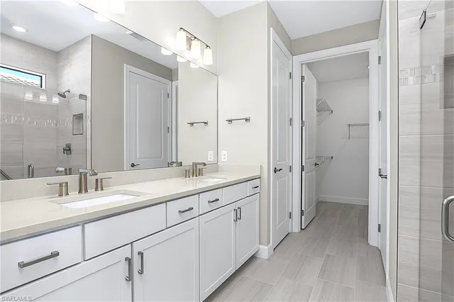 a bathroom with a double vanity sink mirror and double