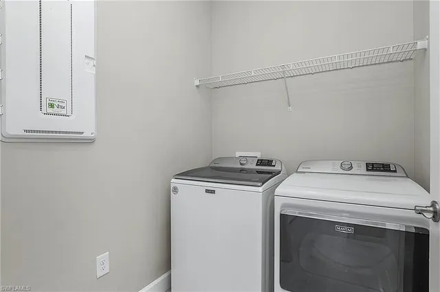 a utility room with dryer and washer