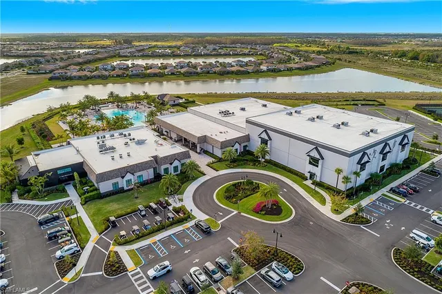an aerial view of a house with a ocean view