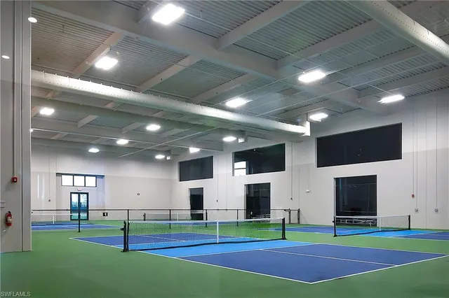 a living room with fireplace and a flat screen tv