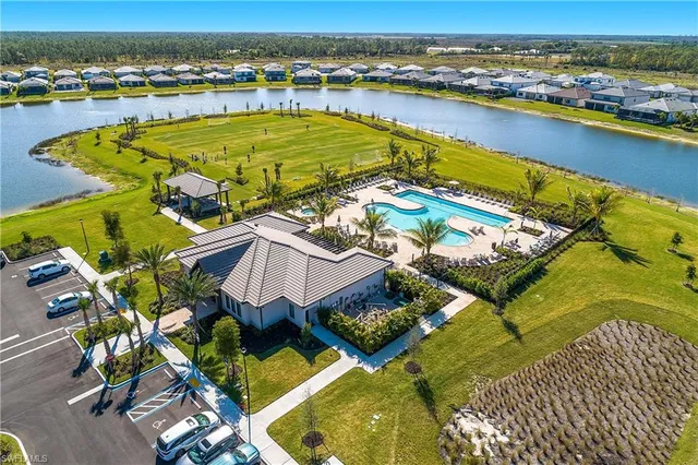 an aerial view of a house with a swimming pool