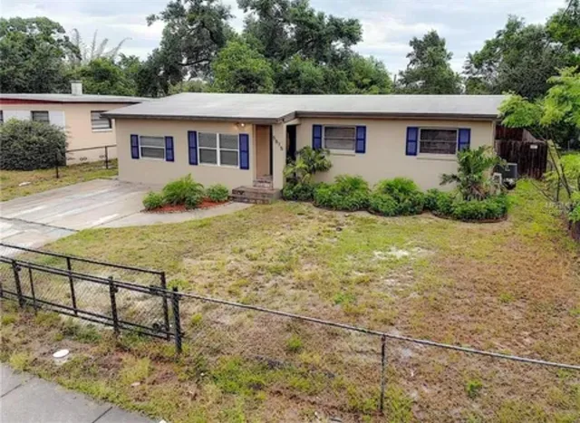 a house view with a backyard space