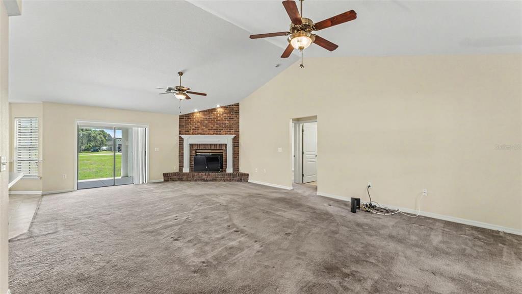 8525 North Campbell Road Lakeland, FL 33810 - Photo 39 of 45 an empty room with windows and fireplace