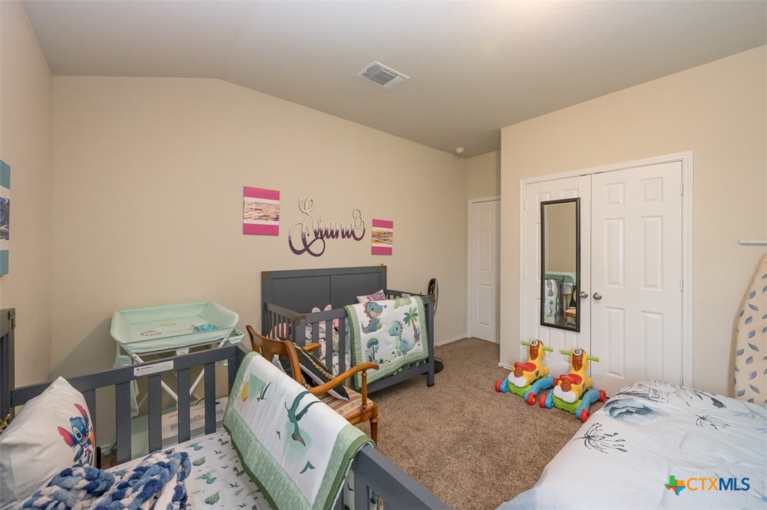 2511 Pintail Loop Copperas Cove, TX 76522 - Photo 21 of 26 a bedroom with furniture and a wooden floor