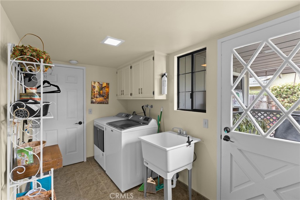 802 Pierce Drive Santa Maria, CA 93454 - Photo 11 of 42 a kitchen with a sink a stove a window and a dining table