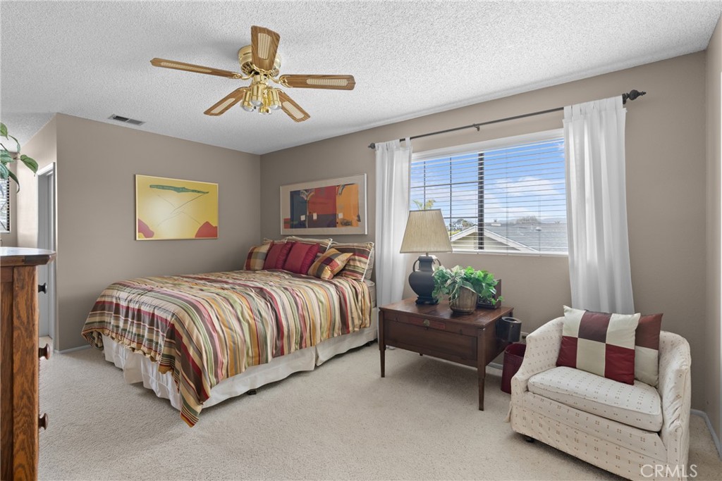 802 Pierce Drive Santa Maria, CA 93454 - Photo 22 of 42 a spacious bedroom with a bed and a couch