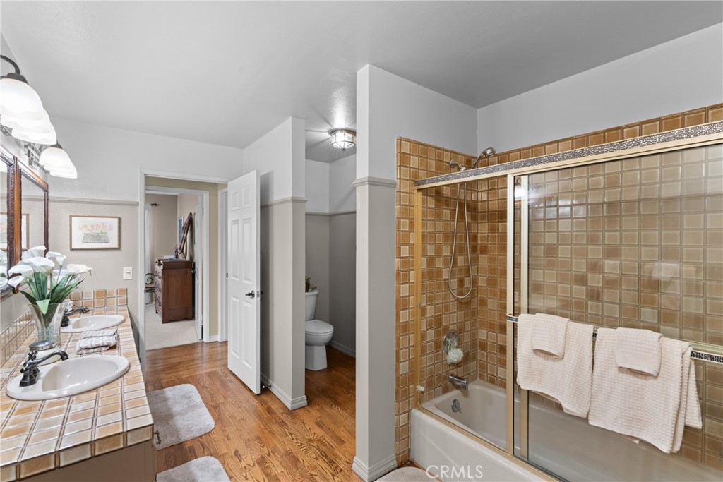 802 Pierce Drive Santa Maria, CA 93454 - Photo 24 of 42 a bathroom with a glass shower door