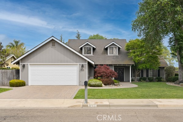 802 Pierce Drive Santa Maria, CA 93454 - Photo 3 of 42 a front view of a house with a garden and plants