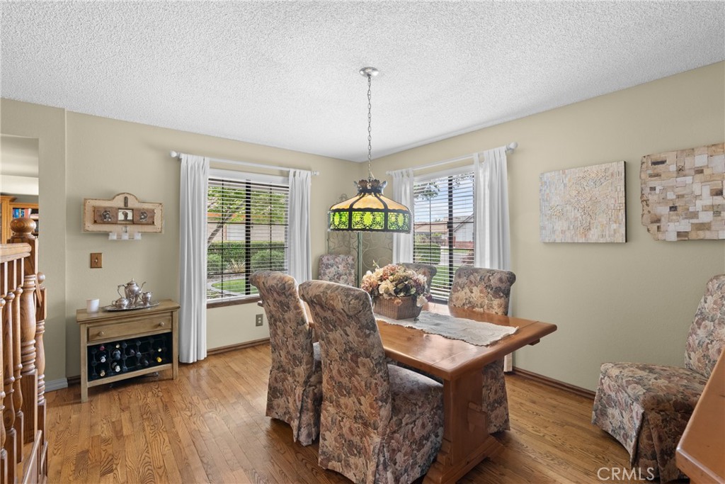802 Pierce Drive Santa Maria, CA 93454 - Photo 7 of 42 a living room with furniture a window and a chandelier