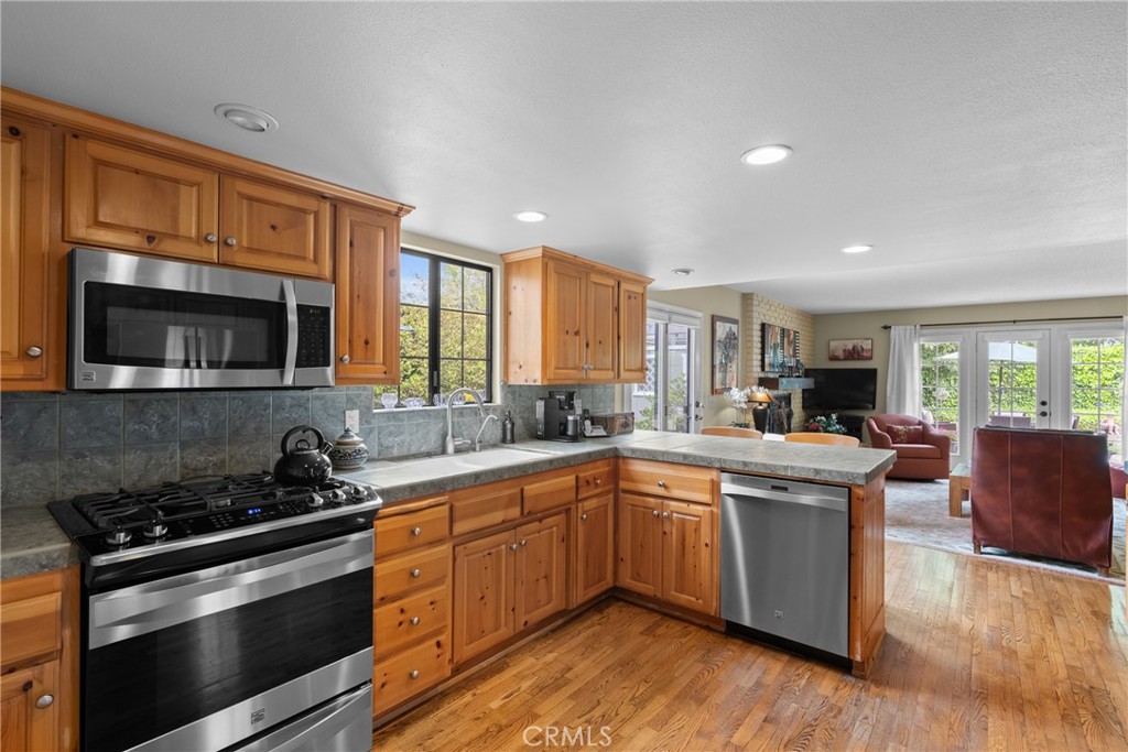802 Pierce Drive Santa Maria, CA 93454 - Photo 8 of 42 a kitchen with stainless steel appliances a stove sink and cabinets
