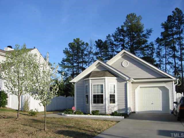 5114 Gable Ridge Drive Durham, NC 27713 - Photo 1 of 1 a front view of a house with a garden