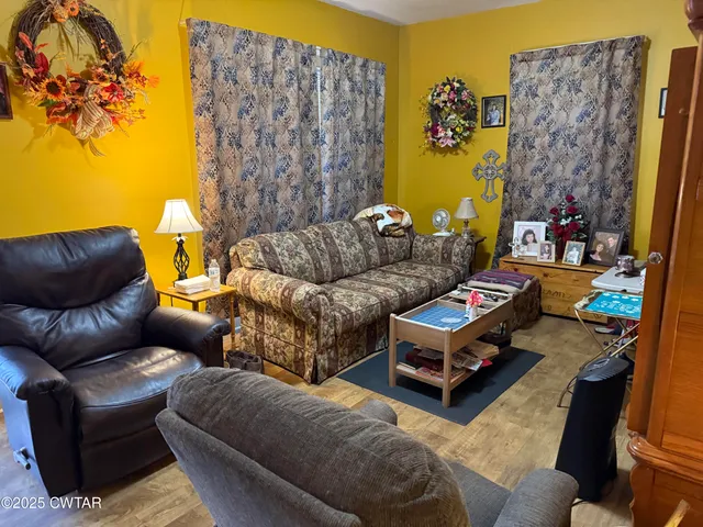 a living room with furniture a couch and a fireplace