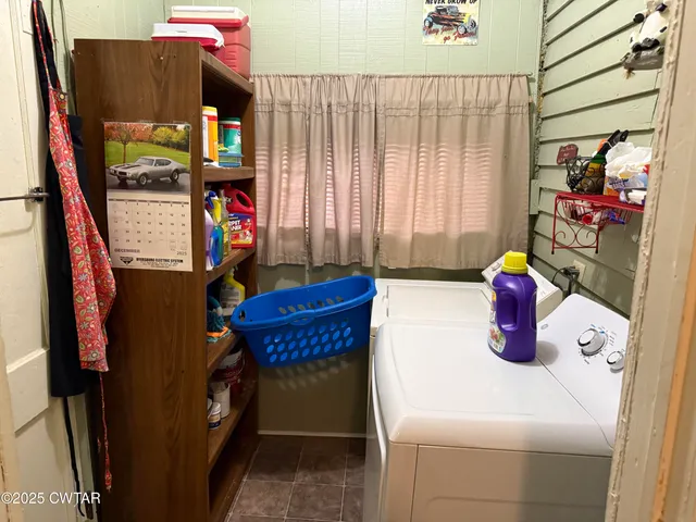 a kitchen with a sink and a refrigerator