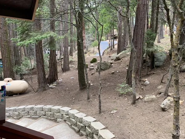 a view of a backyard of the house