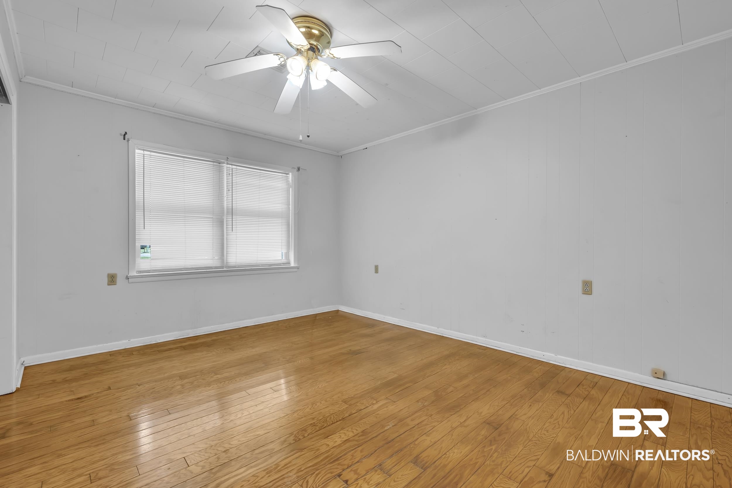 17463 Highway 98 Foley, AL 36535 - Photo 18 of 57 Empty room with hardwood / wood-style floors, ornamental molding, and ceiling fan