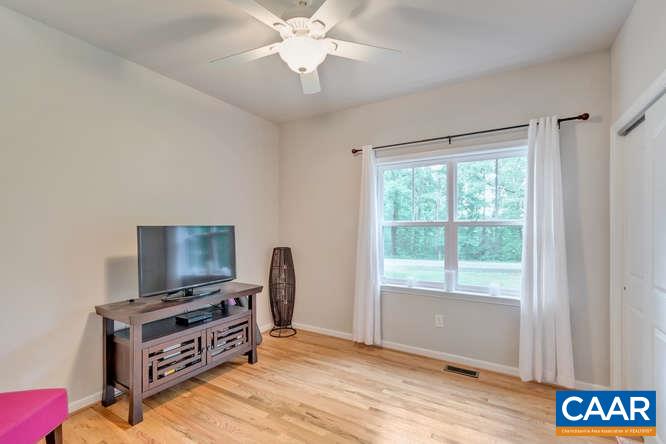 2508 Buck Island Road Charlottesville, VA 22902 - Photo 16 of 23 a living room with furniture and a flat screen tv