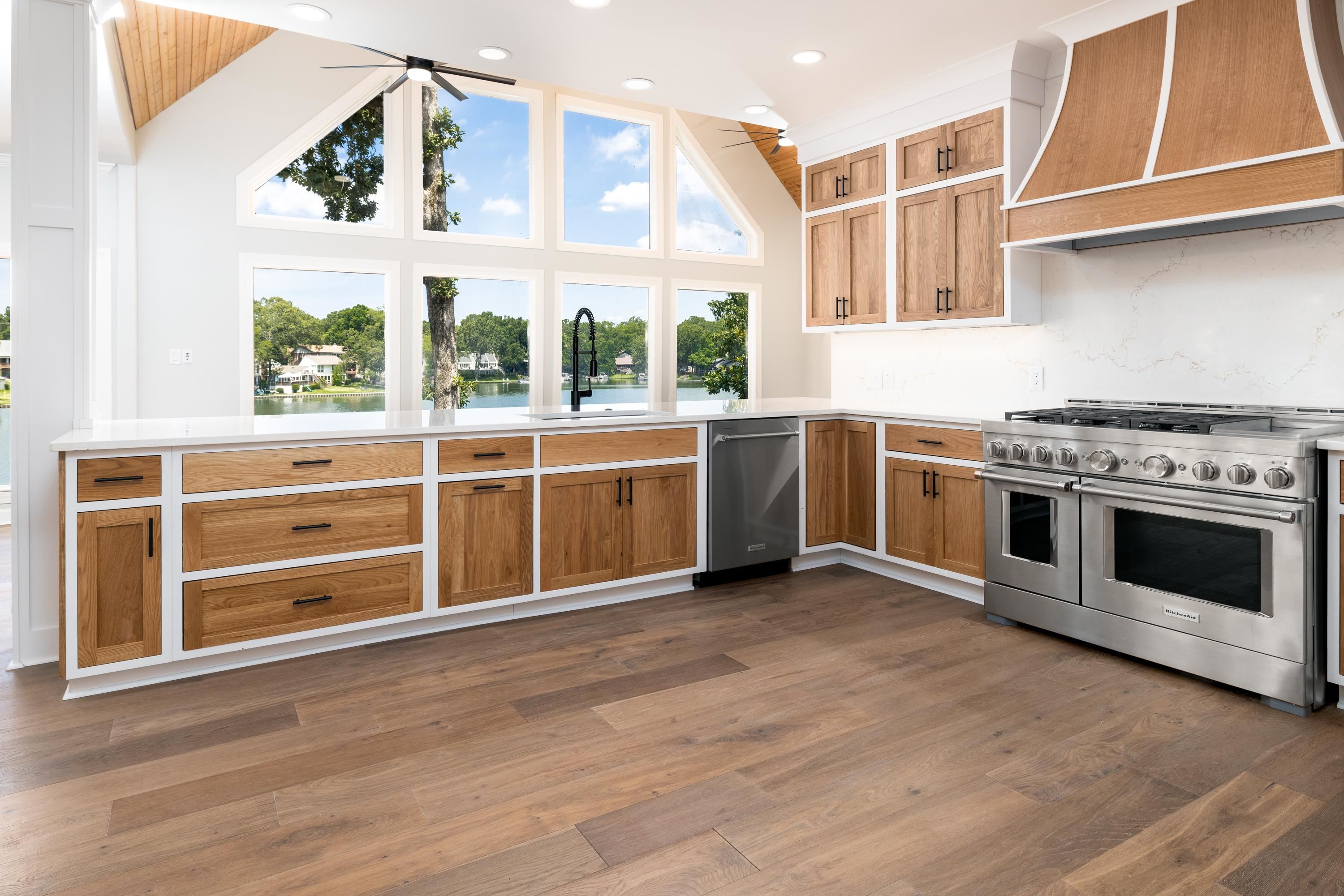 4175 Cedar Point Road Lakeland, TN 38002 - Photo 13 of 37 a view of a kitchen with wooden floor and stainless steel appliances
