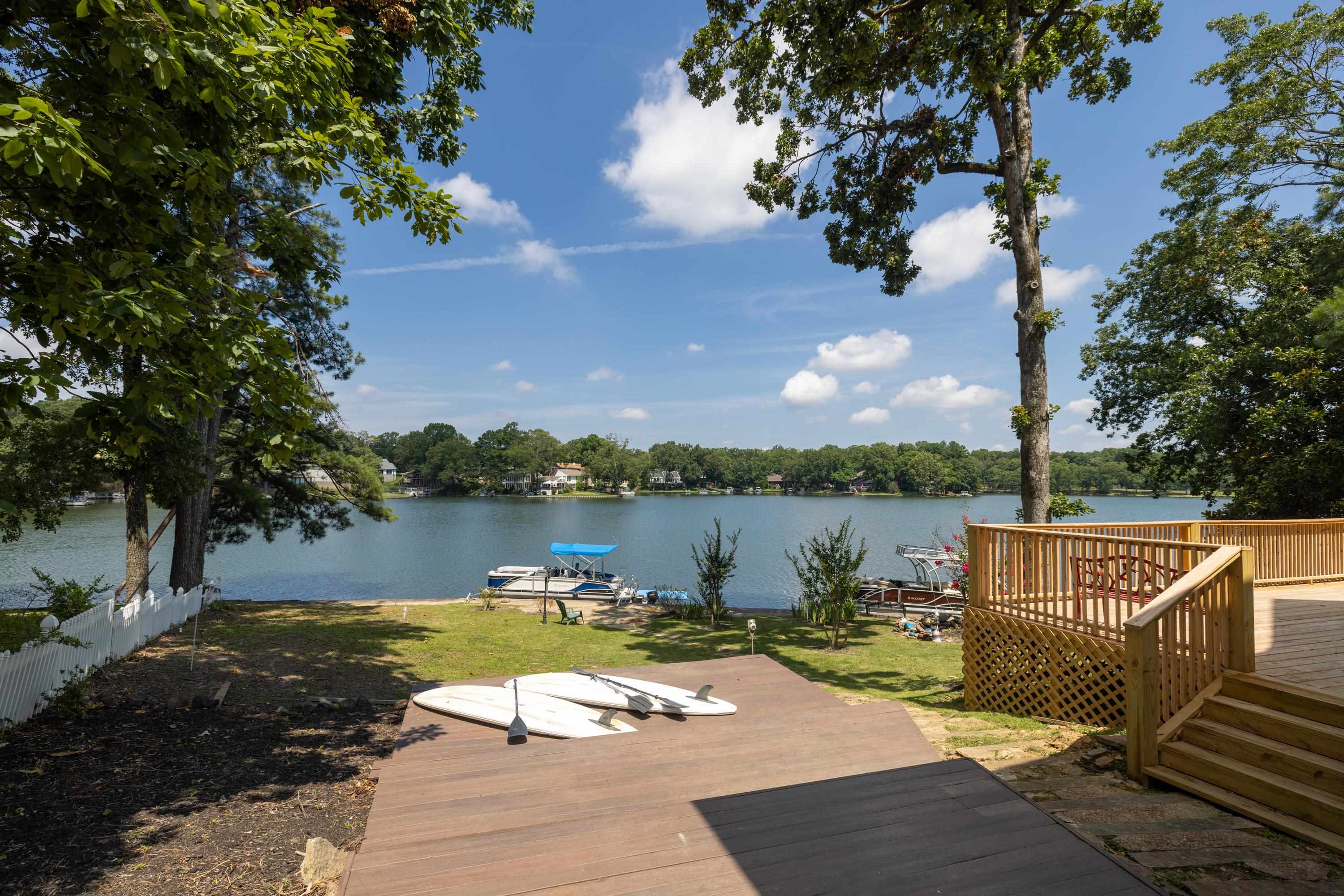 4175 Cedar Point Road Lakeland, TN 38002 - Photo 15 of 37 a view of a lake with couches in the patio