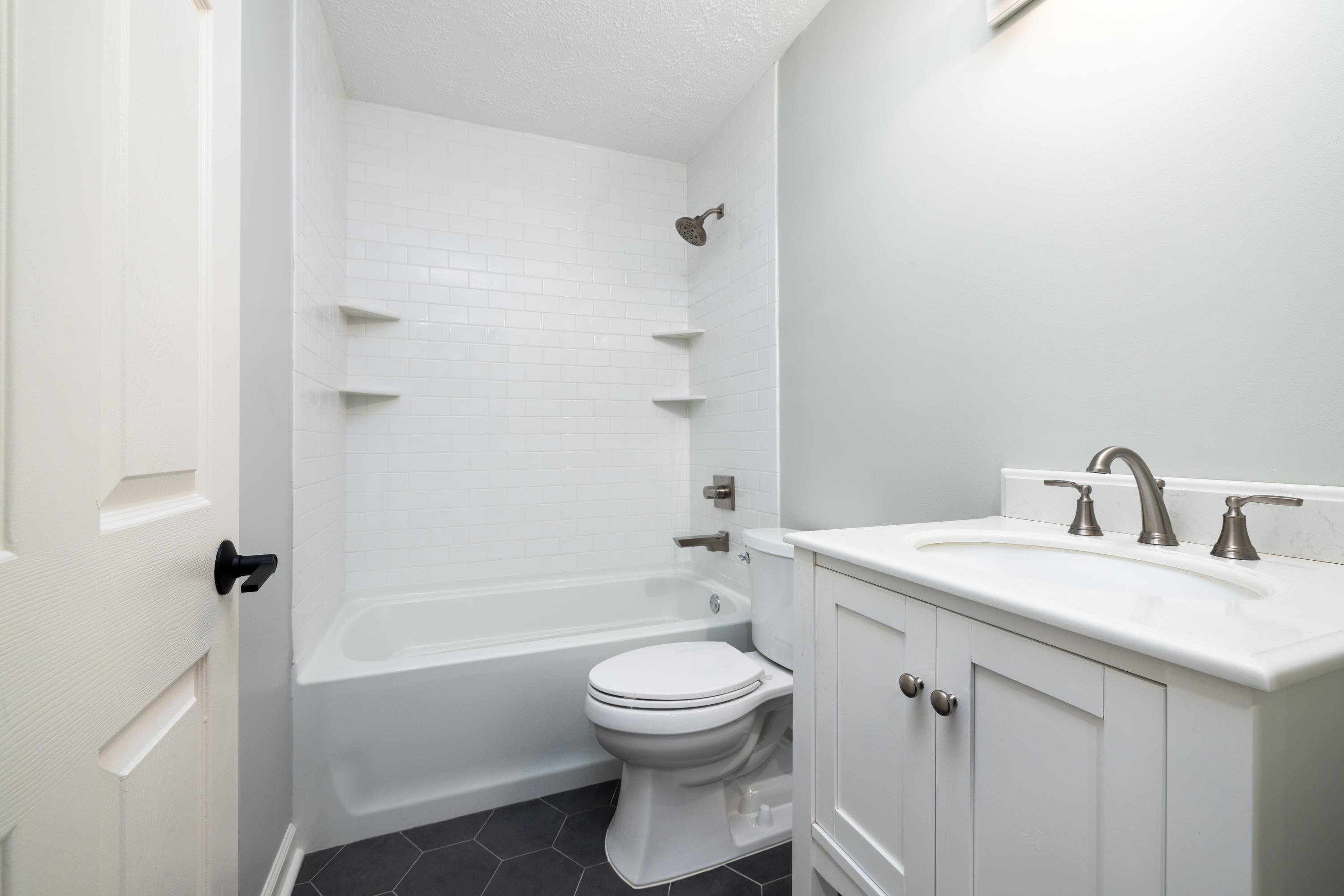 4175 Cedar Point Road Lakeland, TN 38002 - Photo 24 of 37 a bathroom with a sink a toilet and shower
