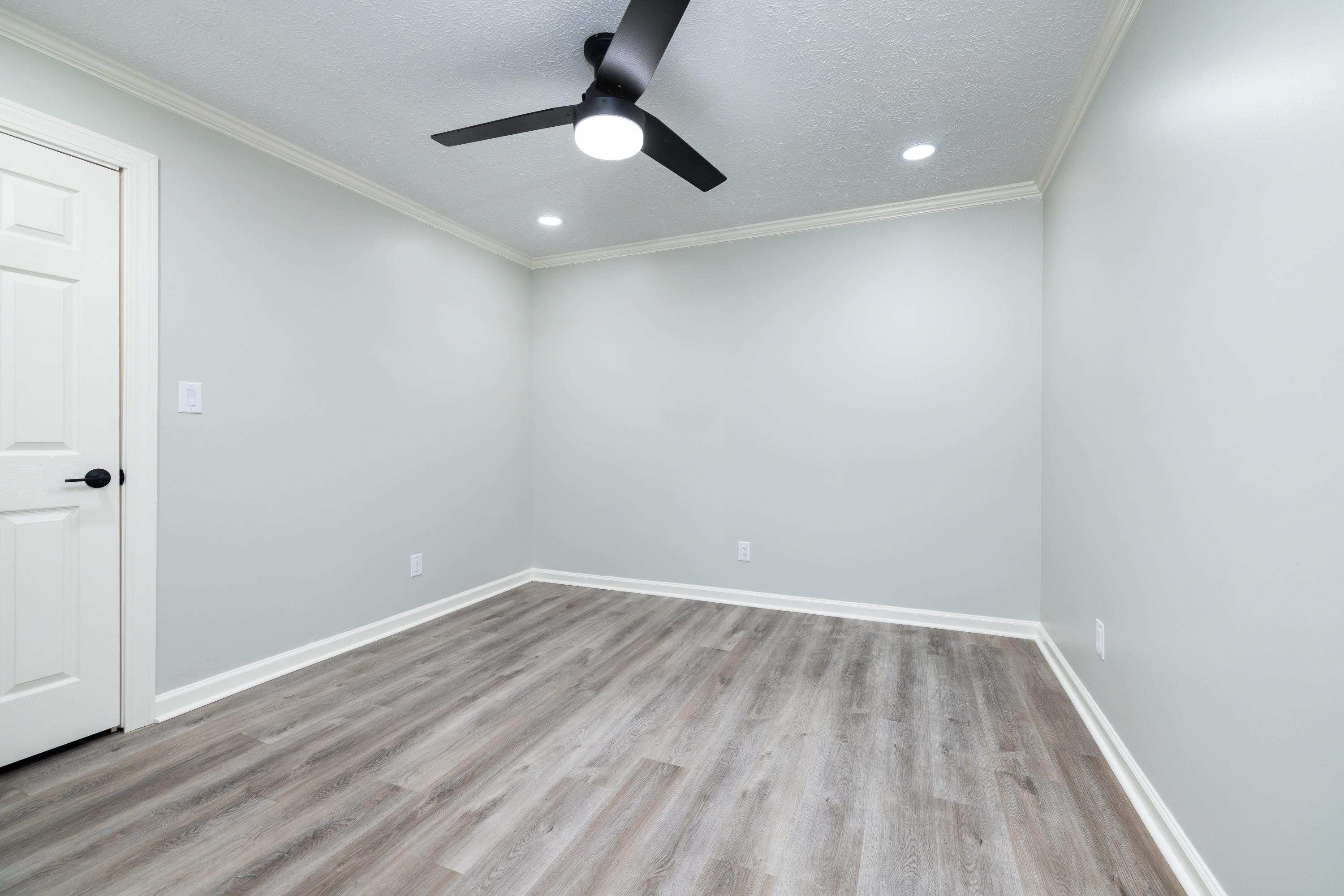 4175 Cedar Point Road Lakeland, TN 38002 - Photo 25 of 37 an empty room with wooden floor and windows