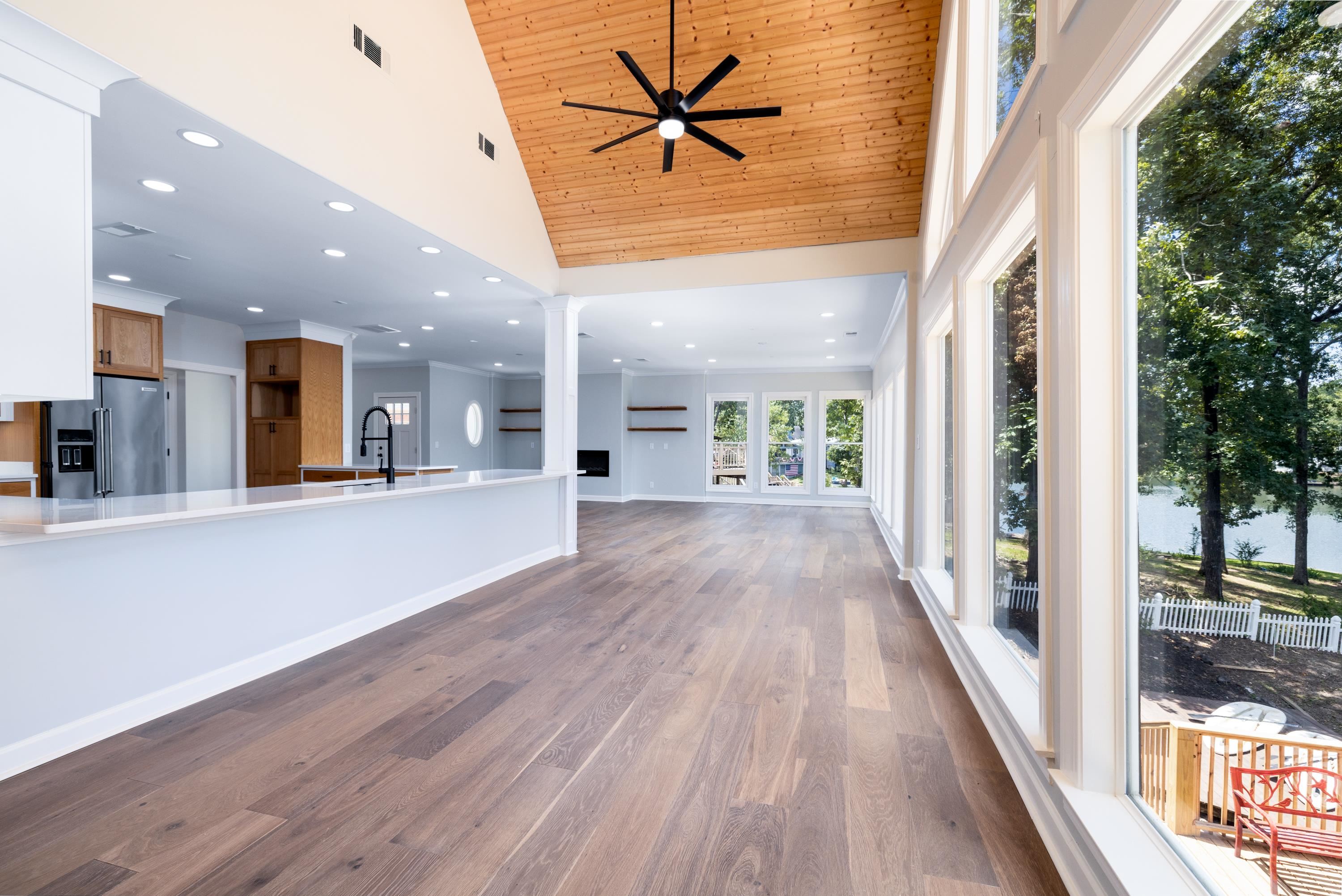 4175 Cedar Point Road Lakeland, TN 38002 - Photo 29 of 37 a view of a big room with wooden floor and a kitchen