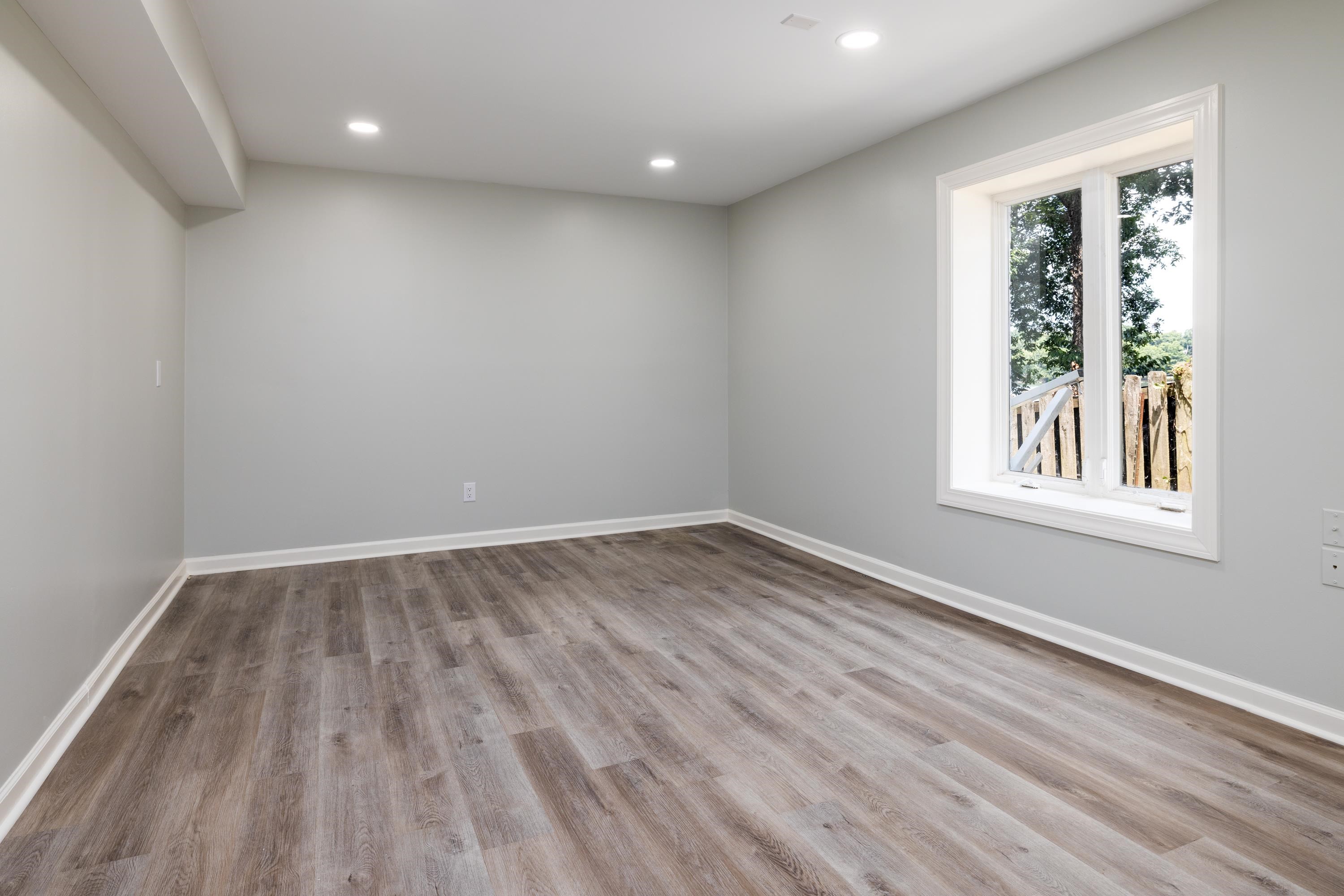 4175 Cedar Point Road Lakeland, TN 38002 - Photo 34 of 37 wooden floor in an empty room with a window