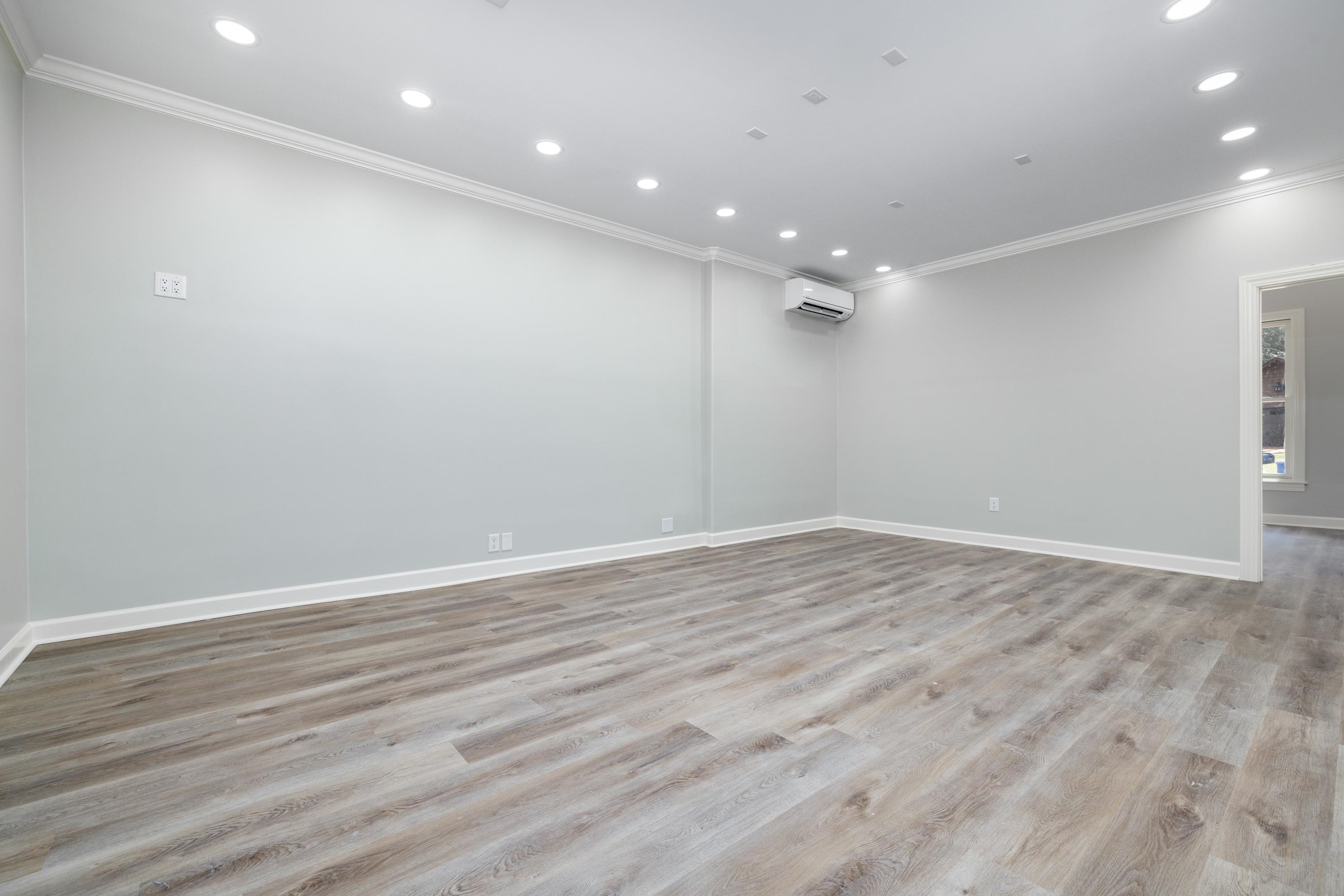 4175 Cedar Point Road Lakeland, TN 38002 - Photo 4 of 37 an empty room with wooden floor and windows