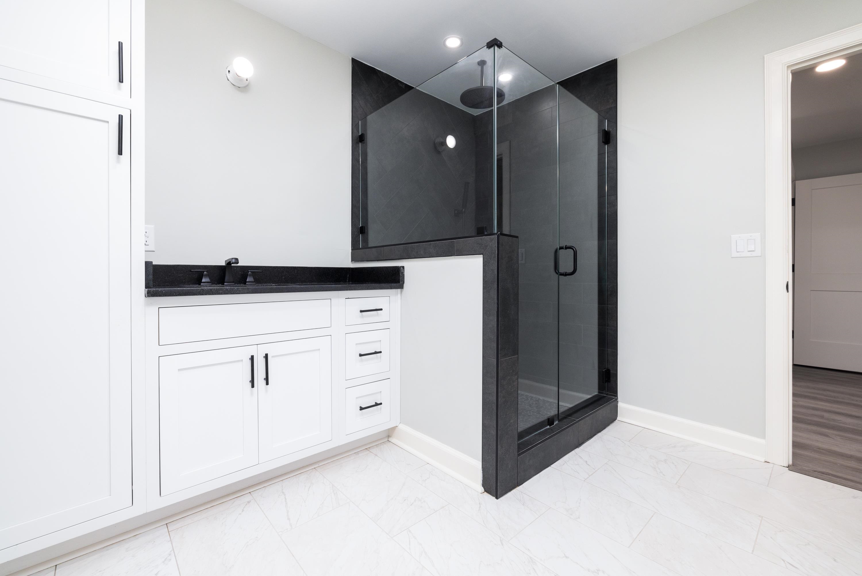 4175 Cedar Point Road Lakeland, TN 38002 - Photo 7 of 37 a bathroom with a shower and a mirror