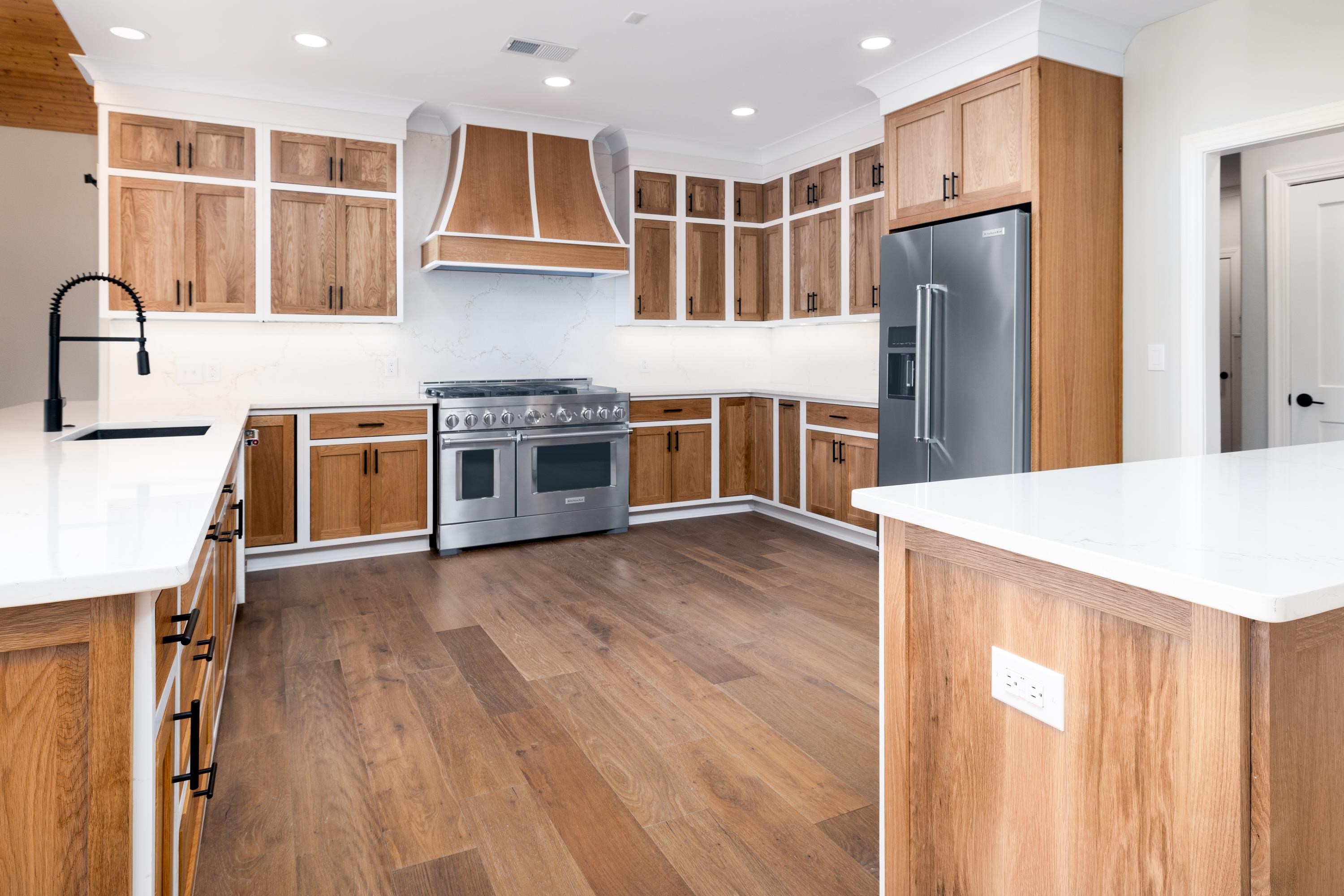 4175 Cedar Point Road Lakeland, TN 38002 - Photo 10 of 37 a kitchen with stainless steel appliances granite countertop a refrigerator a stove and a wooden floors