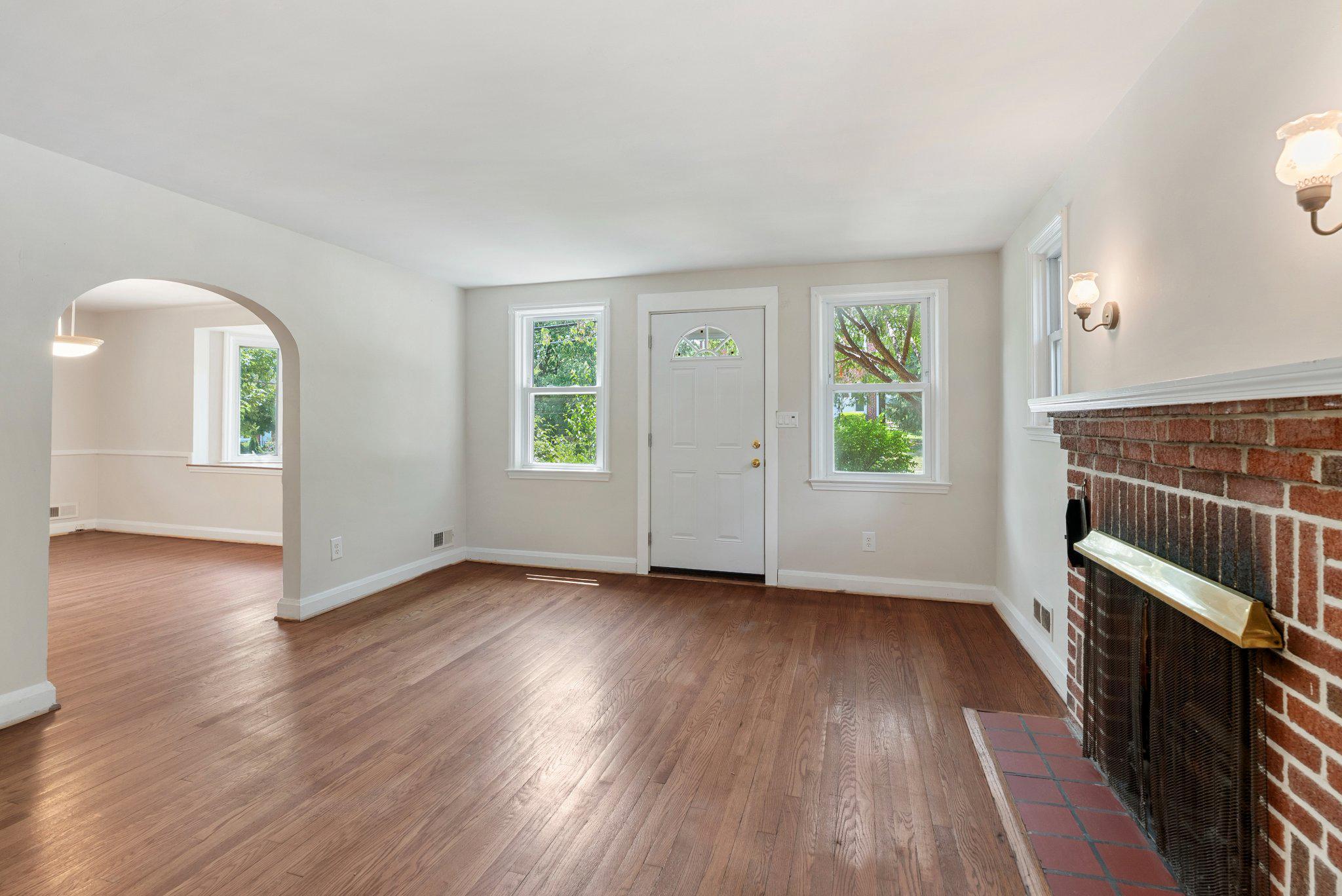 8401 Pleasant Plains Road Baltimore, MD 21286 - Photo 5 of 30 Living room with brick fireplace.