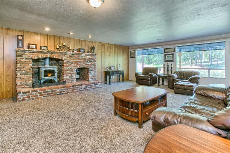 1600 Rounds Avenue Grants Pass, OR 97527 - Photo 19 of 35 a living room with furniture large window and flat screen tv