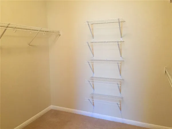 a view of an empty walk in closet