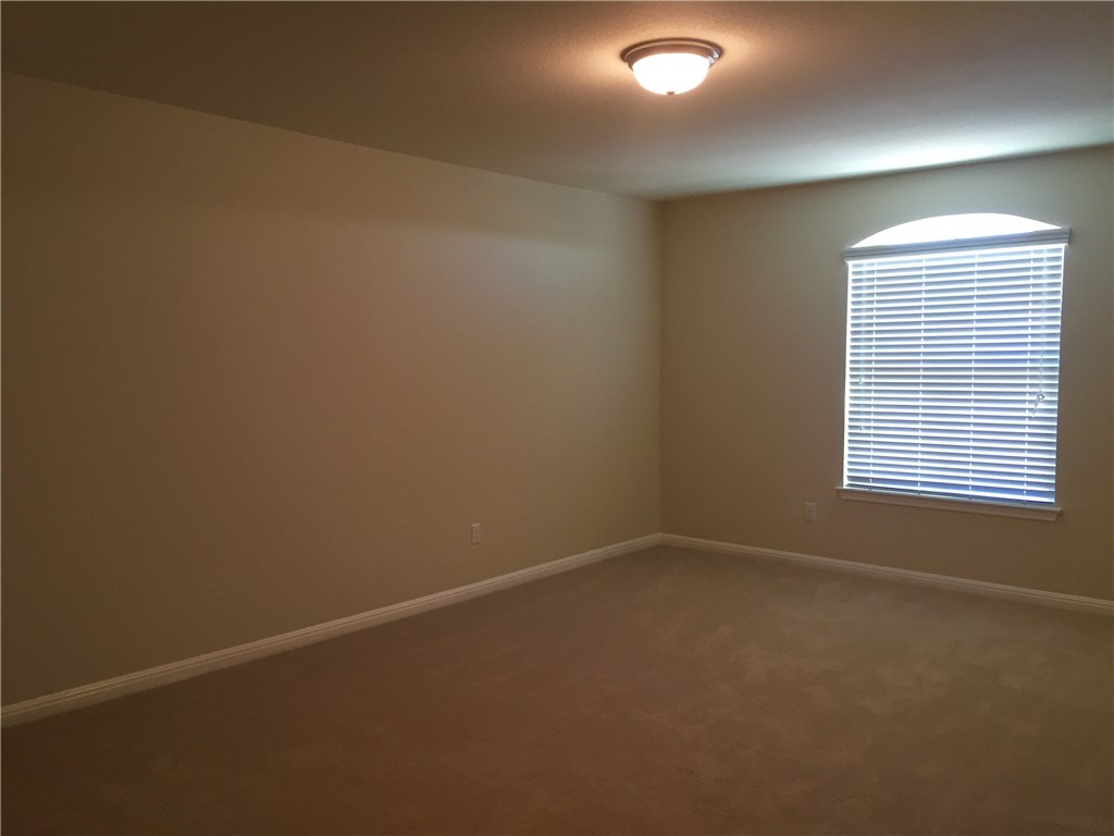 3451 Mayfield Ranch Boulevard, Unit 703 Round Rock, TX 78681 - Photo 19 of 23 an empty room with a window