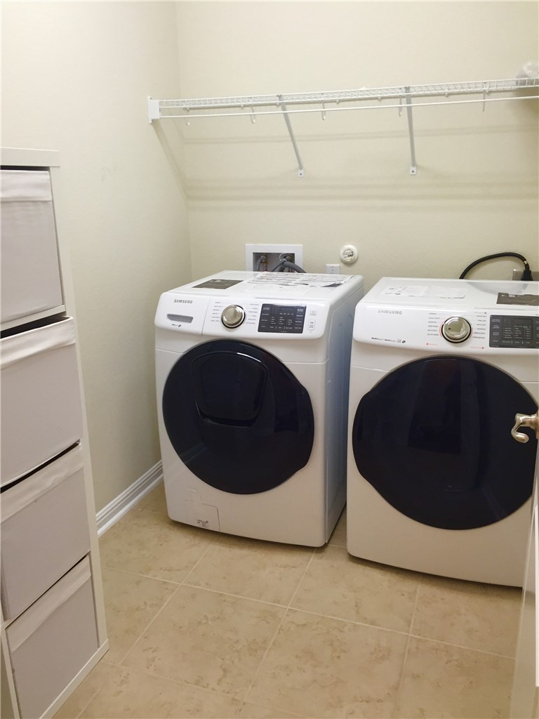 3451 Mayfield Ranch Boulevard, Unit 703 Round Rock, TX 78681 - Photo 21 of 23 a utility room with dryer and washer