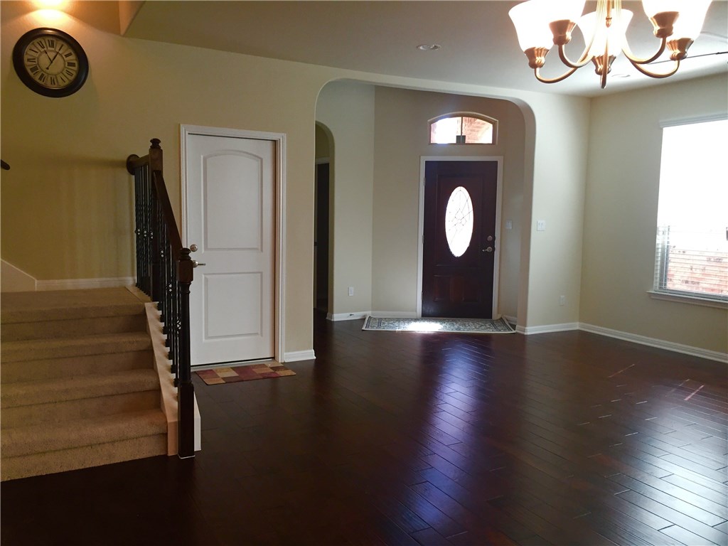 3451 Mayfield Ranch Boulevard, Unit 703 Round Rock, TX 78681 - Photo 3 of 23 a view of an entryway with wooden floor