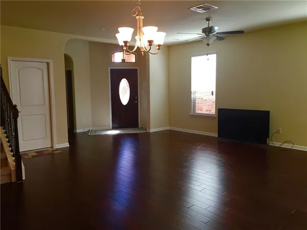 a view of a livingroom with wooden floor