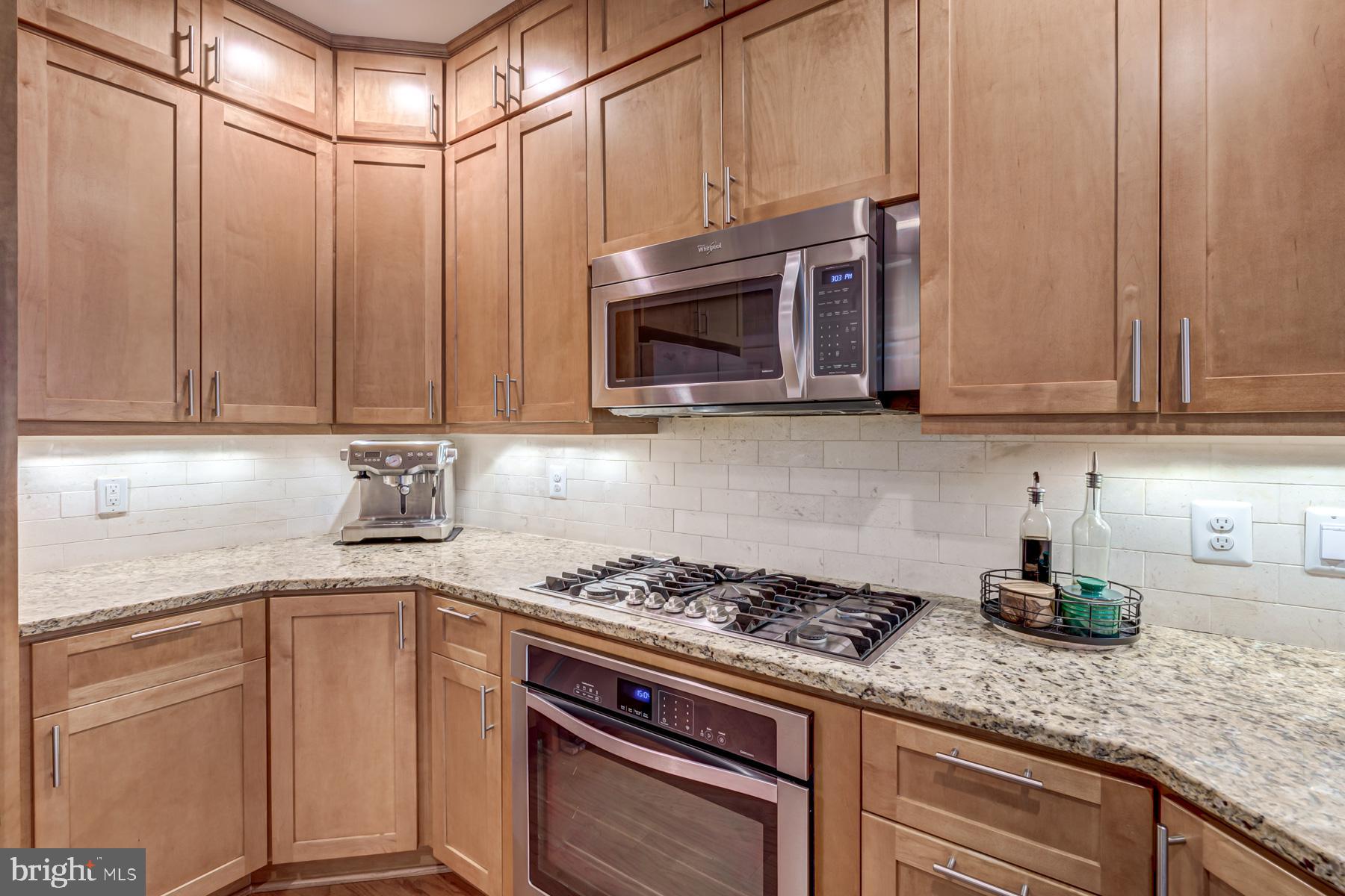 2207 Main Line Boulevard, Unit 101 Alexandria, VA 22301 - Photo 15 of 46 a kitchen with appliances cabinets and a counter top space