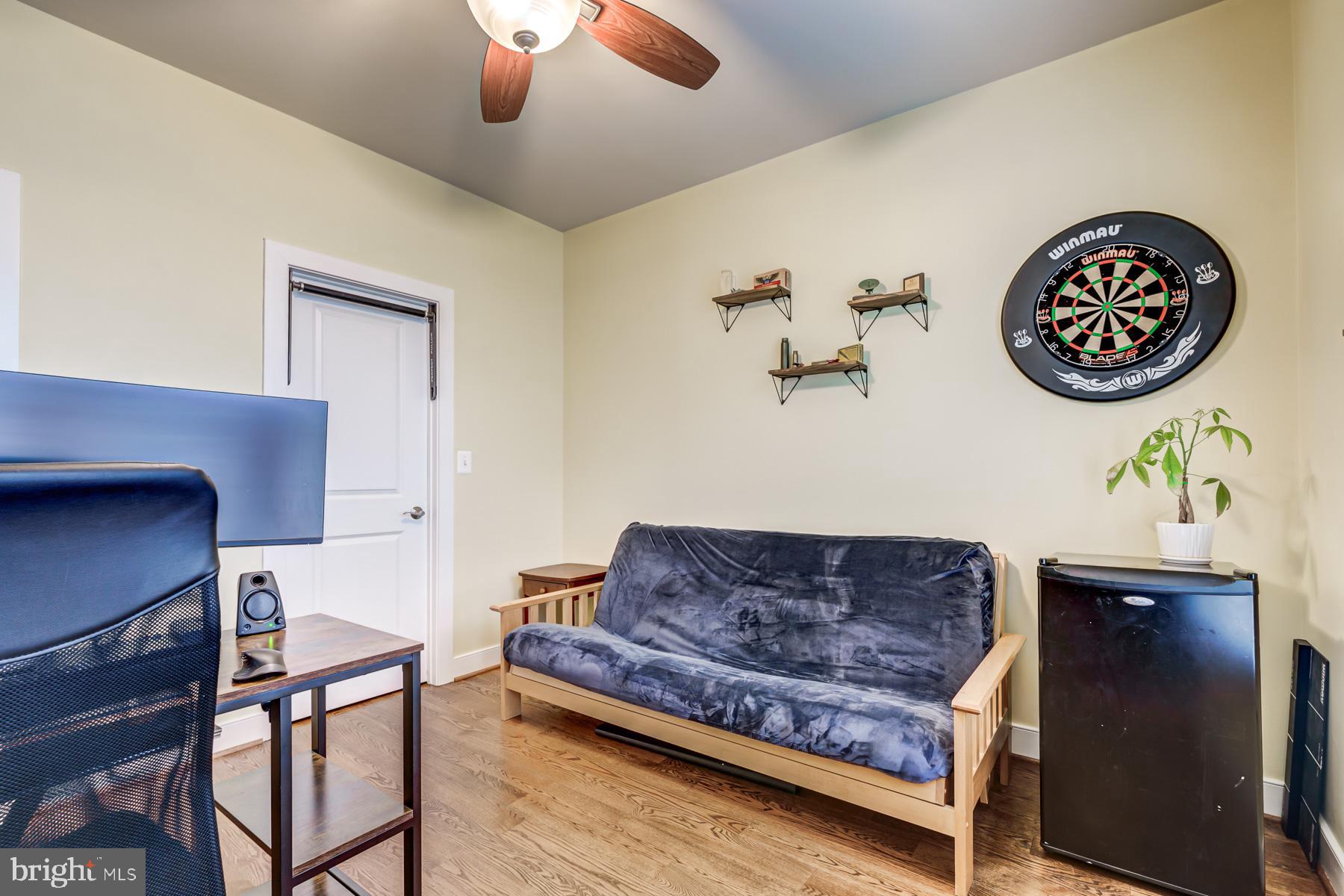 2207 Main Line Boulevard, Unit 101 Alexandria, VA 22301 - Photo 22 of 46 a living room with couch and a chandelier
