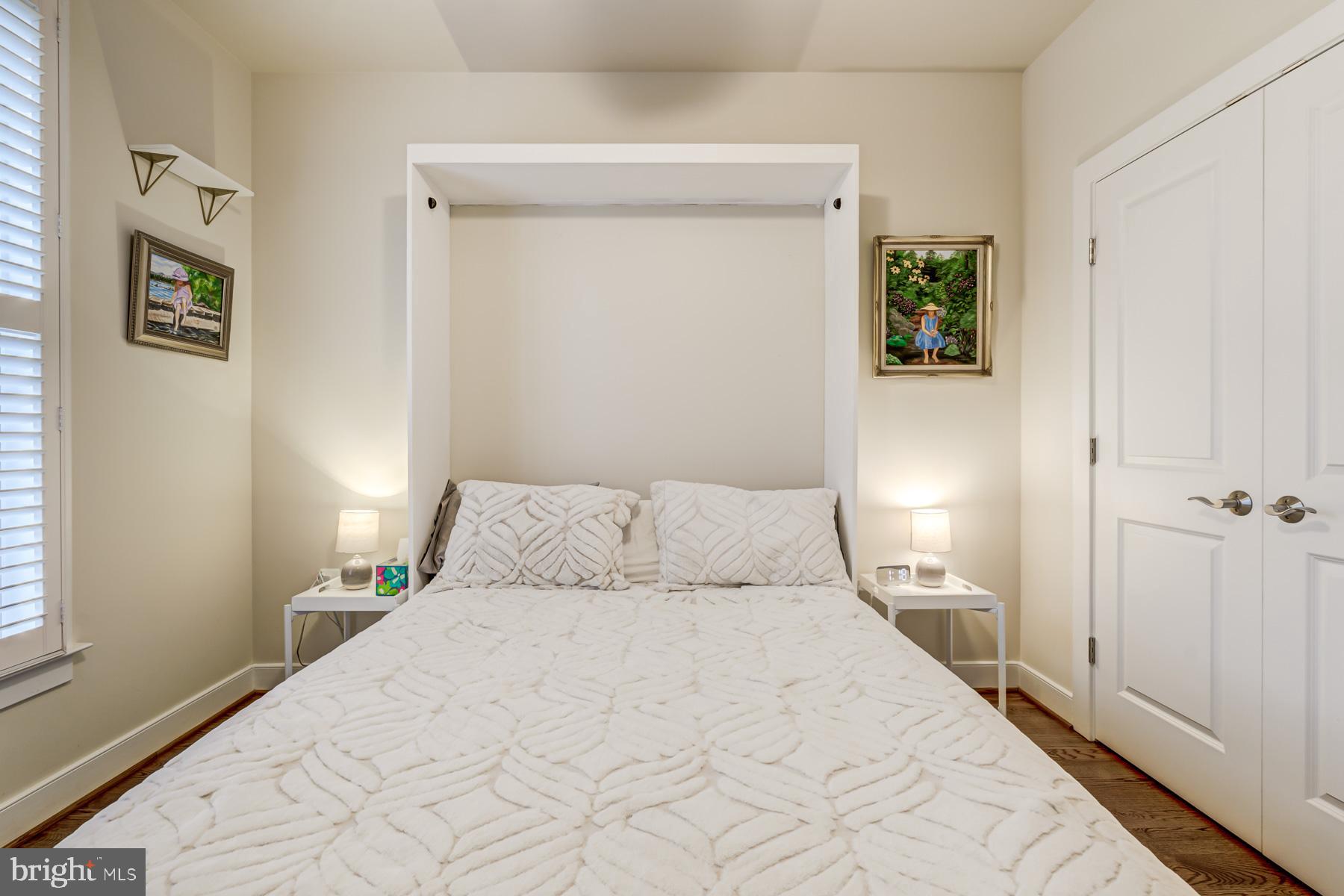 2207 Main Line Boulevard, Unit 101 Alexandria, VA 22301 - Photo 24 of 46 a bedroom with a bed and a window