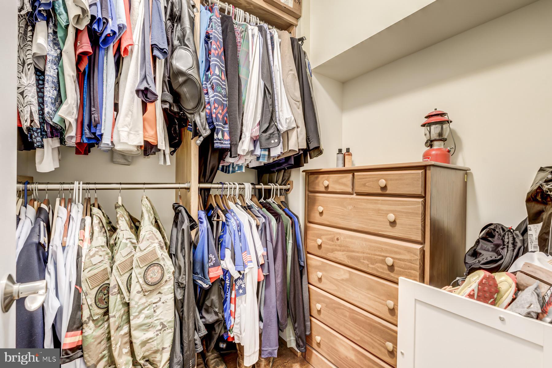 2207 Main Line Boulevard, Unit 101 Alexandria, VA 22301 - Photo 29 of 46 a view of walk in closet with clothes