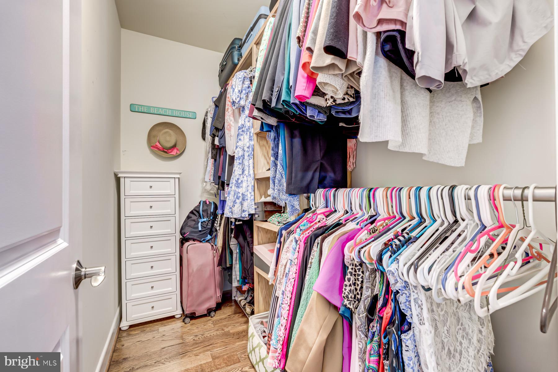 2207 Main Line Boulevard, Unit 101 Alexandria, VA 22301 - Photo 30 of 46 a view of walk in closet with clothes and shoes
