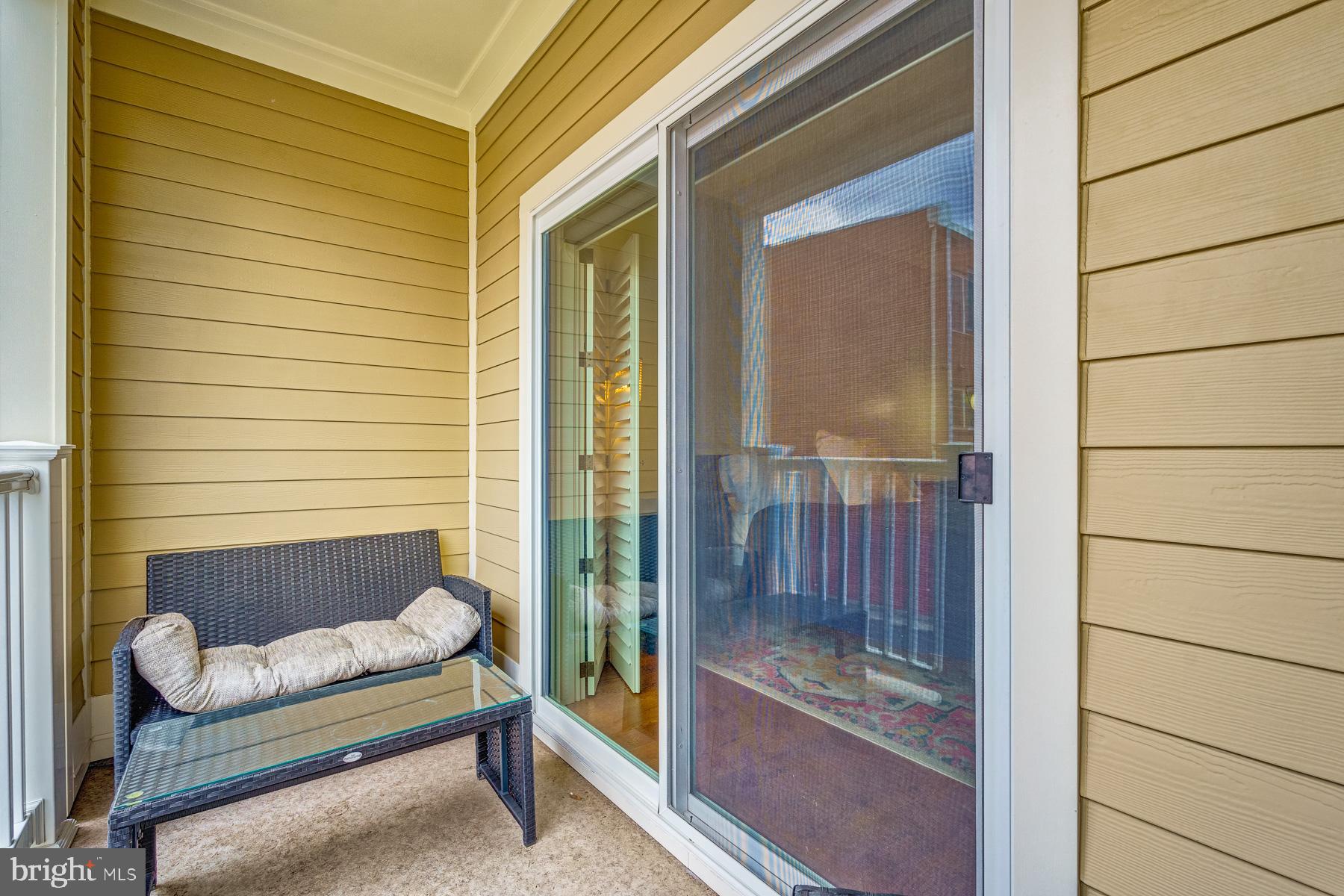 2207 Main Line Boulevard, Unit 101 Alexandria, VA 22301 - Photo 39 of 46 a view of porch with a bench