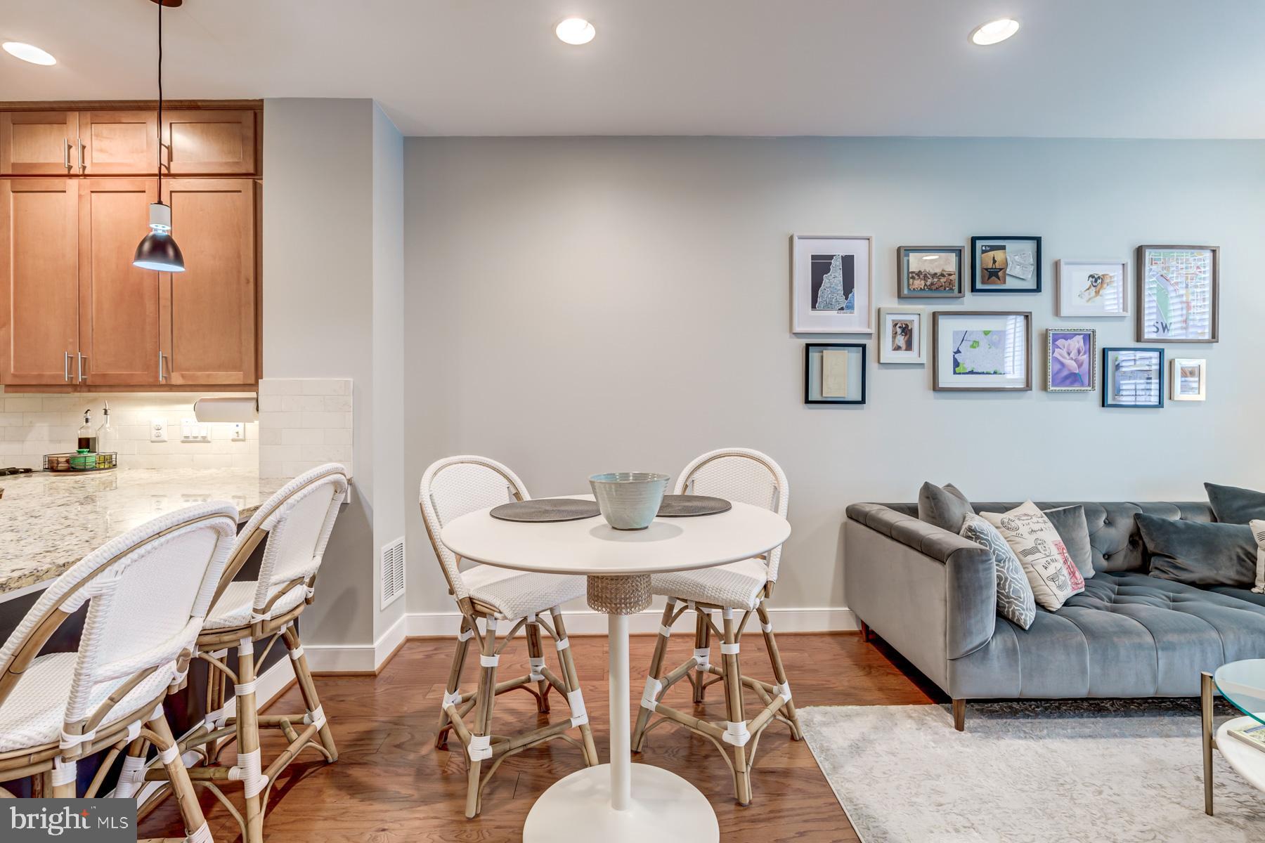 2207 Main Line Boulevard, Unit 101 Alexandria, VA 22301 - Photo 6 of 46 a living room with furniture and a wooden floor