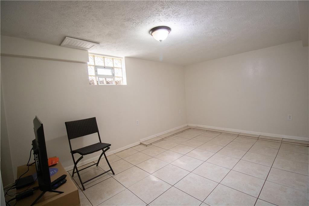 2111 Lewis Run Road Clairton, PA 15025 - Photo 12 of 17 wooden floor in an empty room with a window