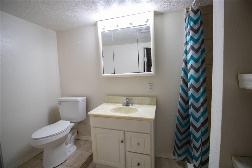 2111 Lewis Run Road Clairton, PA 15025 - Photo 14 of 17 a bathroom with a sink and a toilet